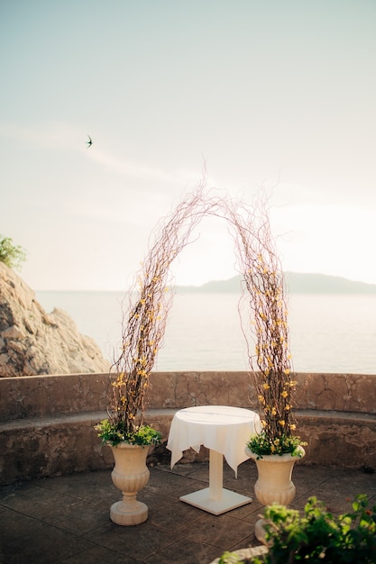 Photo arch for the wedding ceremony on the sea