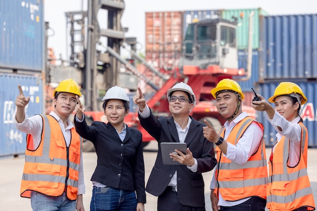 architect of engineer and dock worker staff working checking at container cargo 