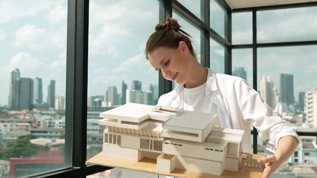 Photo architect engineer raised house model while inspect carefully tracery