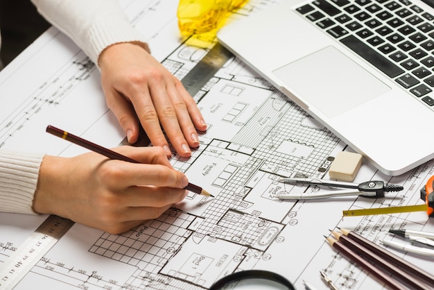 Architect working on blueprint