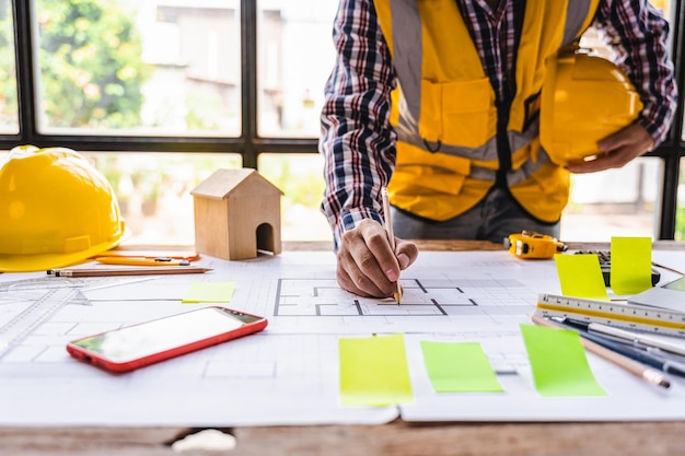 Architects and engineer create architectural works from their blueprints construction models for use in realworld building construction