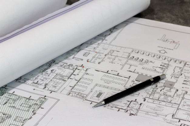 Architectural design with mechanical pencil on top - selective focus