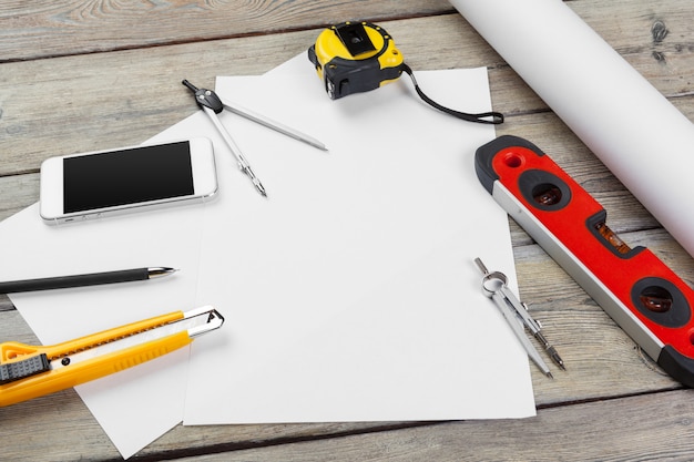 Architectural drawings. instruments on the worktable. blank sheet of paper