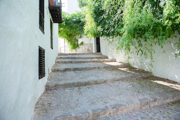 The architecture of the island of Ibiza A charming empty white street in the old town of Eivissa