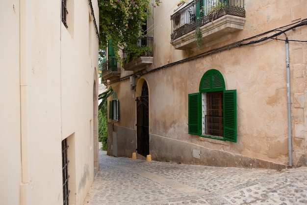 The architecture of the island of Ibiza A charming empty white street in the old town of Eivissa