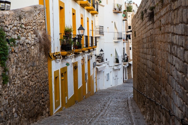 The architecture of the island of Ibiza A charming empty white street in the old town of Eivissa