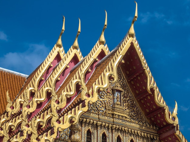 Architecture roof of the temple in Thailand with blue sky. 