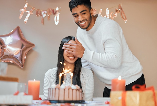 Are you ready for your big surprise Shot of a young couple celebrating a birthday at home