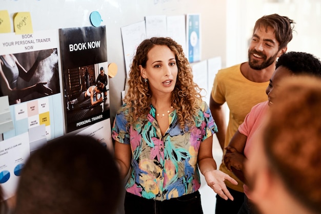 Photo are you seeing the bigger picture cropped shot of an attractive young female designer giving a presentation in the boardroom