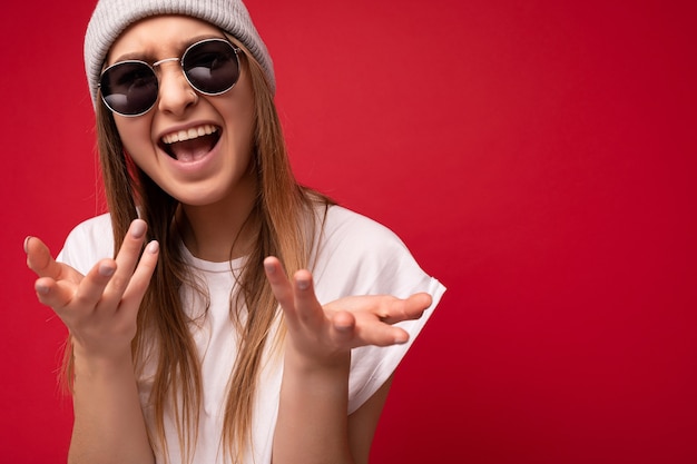 Are you serious closeup photo of beautiful attractive shocked amazed surprised young woman with open