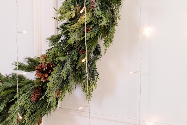 The area is decorated with a Christmas tree and garlands New Year's room decor