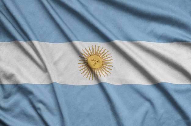 Argentina flag  is depicted on a sports cloth fabric with many folds.