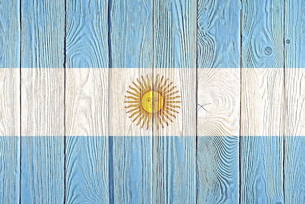 Argentina flag painted on old wood plank background Brushed natural light knotted wooden board texture Wooden texture background flag of Argentina