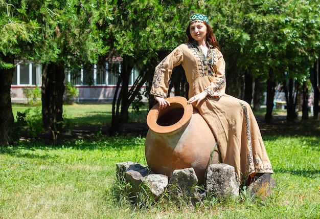 Armenian young woman in traditional clothes in the park woman with traditionnal clothes