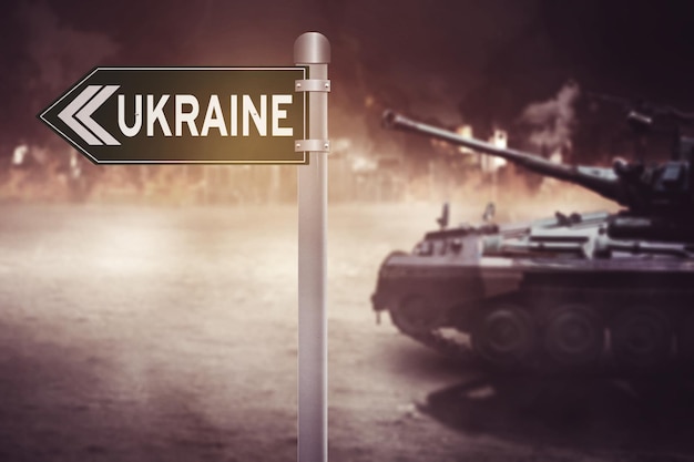 Army tank moving near Ukraine word on the signpost