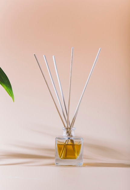 aroma liquid in glass bottle with sticks