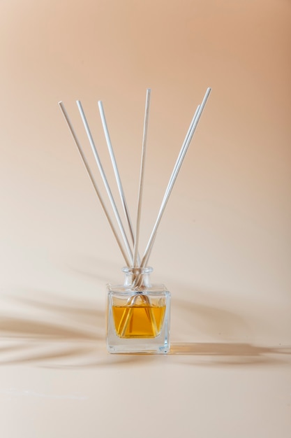 aroma liquid in glass bottle with sticks