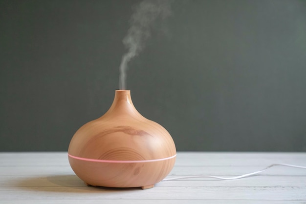 Aroma oil diffuser on table