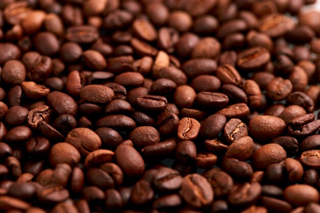 Aroma roasted coffee beans, brown at an angle background