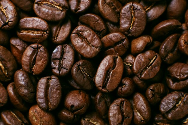 Aroma roasted coffee beans, brown background