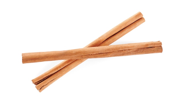 Aromatic cinnamon sticks on white background top view