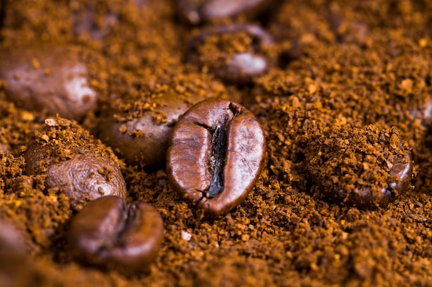 Aromatic coffee beans during the preparation of the drink, delicious and fragrant whole coffee beans on the surface