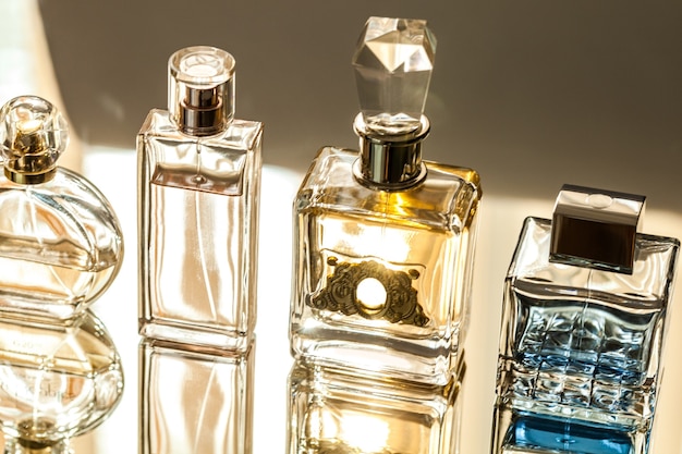 Aromatic Perfume bottles on background