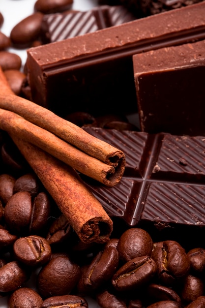 Arrangement of chocolate, coffee and cinnamon sticks