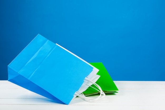 Arrangement of shopping bags on blue 