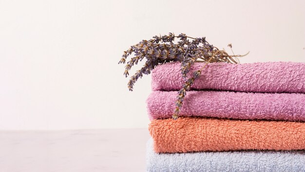 Arrangement with colorful towels and flower