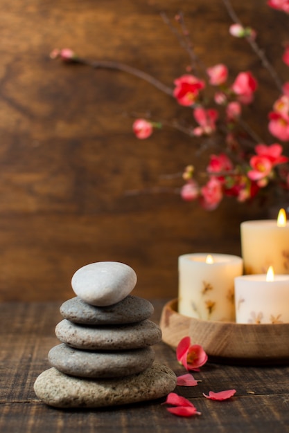 Arrangement with spa stones and lit candles