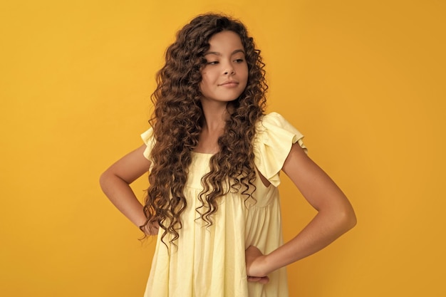 Photo arrogant kid with long curly hair and perfect skin portrait