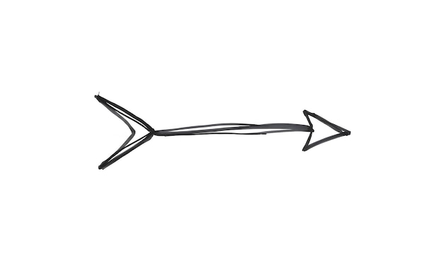 Photo an arrow sign drawn with black marker on isolated with white highlights