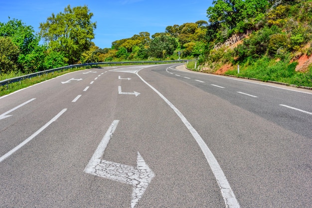 Arrows on a country road in Italy