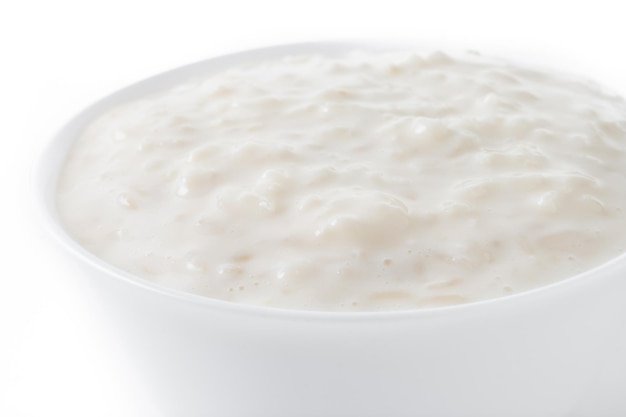 Arroz con leche Rice pudding with cinnamon isolated on white background