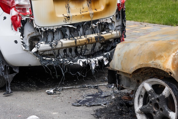 arson for revenge burnt car parked on the street closeup