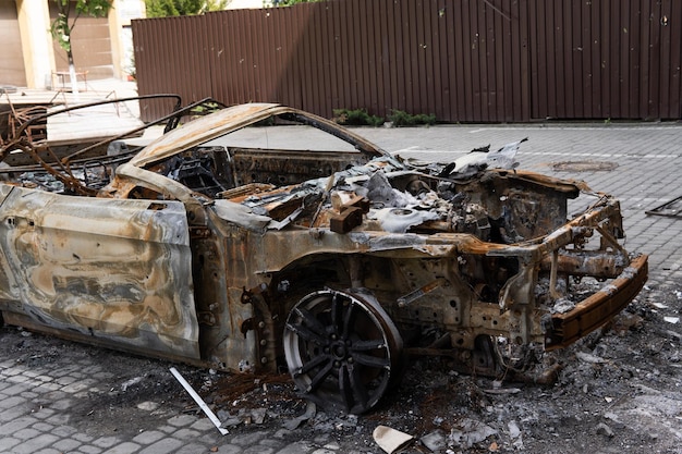 arson for revenge burnt car parked on the street closeup