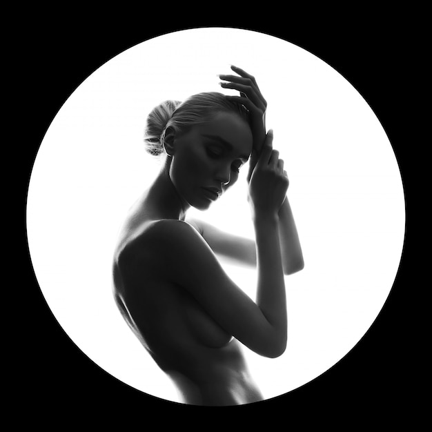 Art beauty Nude woman on black in white circle ring