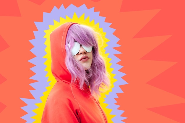 Photo art collage with alternative funky girl with pink hair on bright blue yellow pink background. close up fashion portrait young beautiful woman in hoodie and white glasses. unusual youth fashion concept