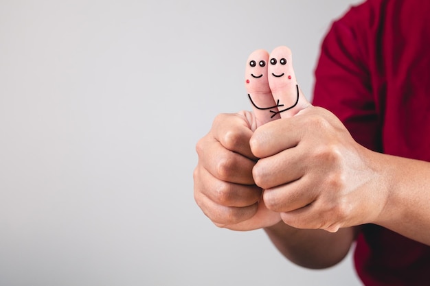 Art of love on Fingers Hugging of thumbs of hands connectedly Valentines day concept with copy space