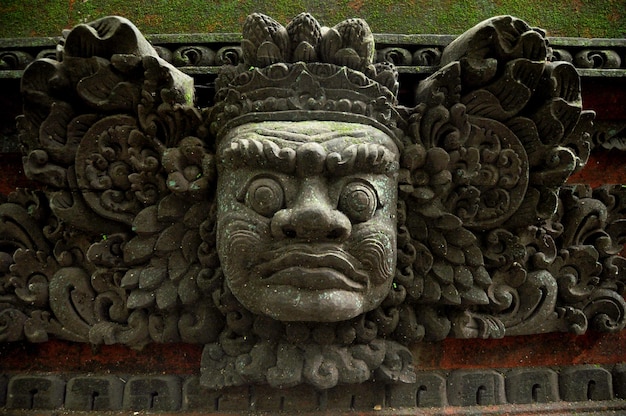 Art sculpture and carved antique deity angel god of hindu statue balinese style in Mandala Suci Wenara Wana or Ubud Sacred Monkey Forest Sanctuary at Ubud city in Bali Indonesia