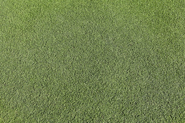 Artificial green grass, soccer field surface texture, top view