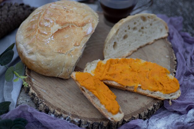 Artisan bread sliced and spread with vegan carrot pate