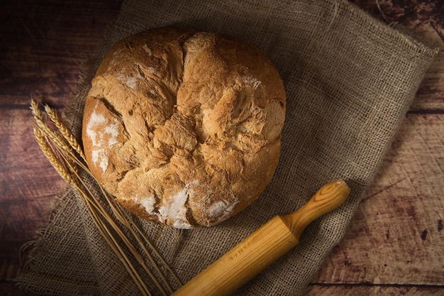 Artisan bread on wooden table.