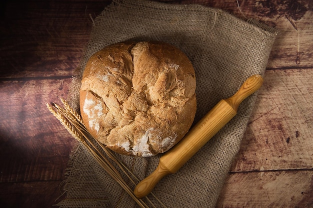 Artisan bread on wooden table.