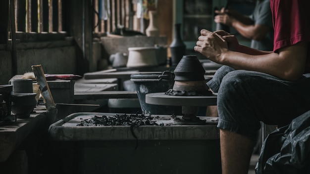 Artisan potter making art pot handicraft