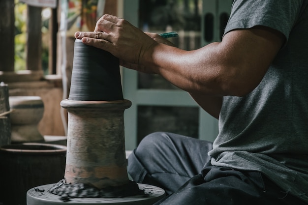 Artisan potter making art pot