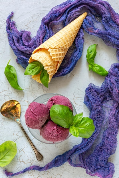 Artisanal blueberry ice cream with green basil