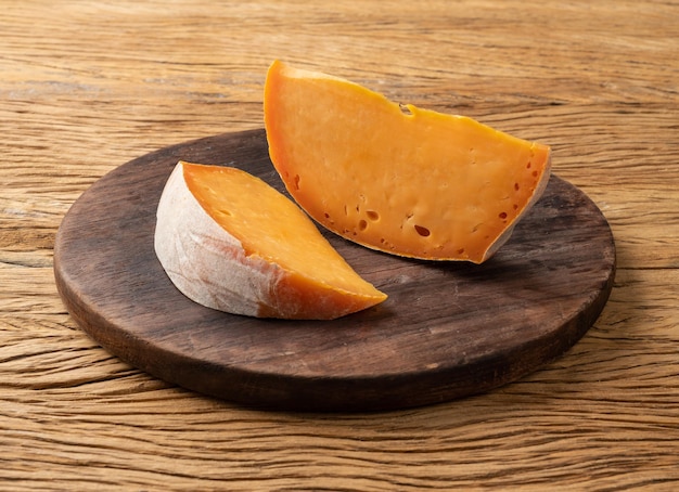 Artisanal Figueira cheese from Brazil over wooden table