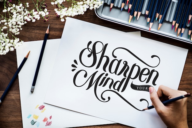 An artist creating hand lettering artwork